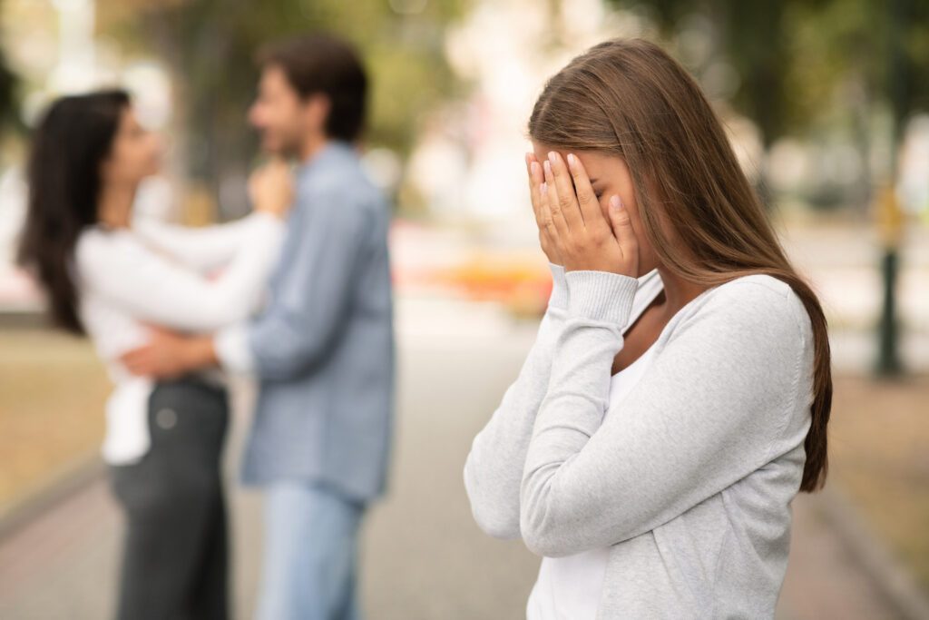 upset woman crying seeing her boyfriend with othe 2023 11 27 05 27 40 utc